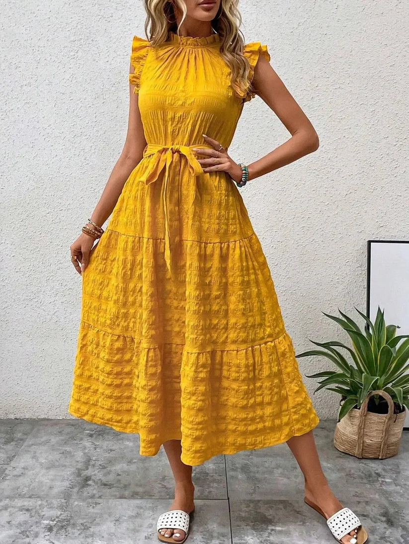 Denise - Elegante vestido con cinturón y volantes
