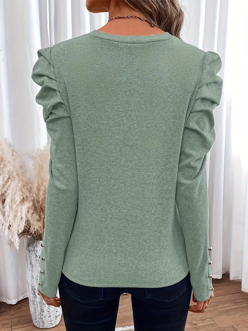 Armeli – Top elegante con mangas abullonada