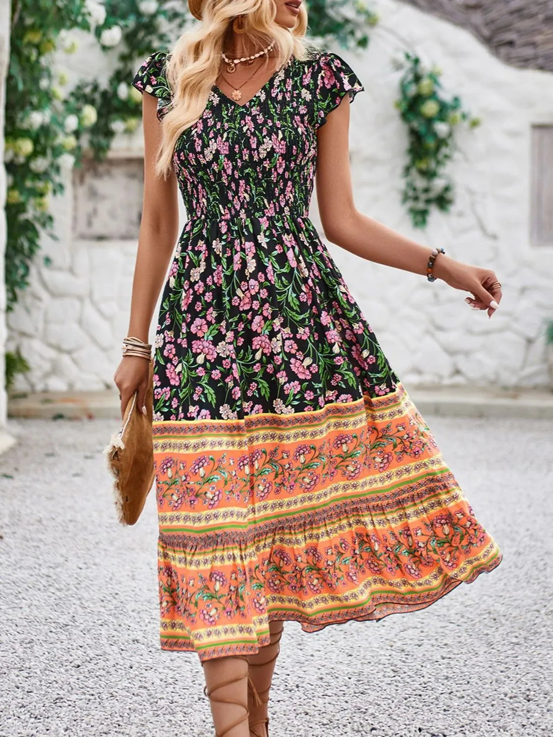 Cassandra - Elegante vestido floral de manga casquillo