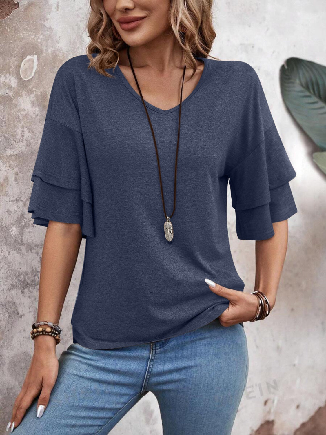 Zayira - Elegante blusa de media manga con volante en capas