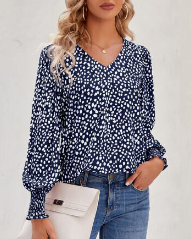 Maureen - Elegante blusa estampada con cuello de pico y manga farol