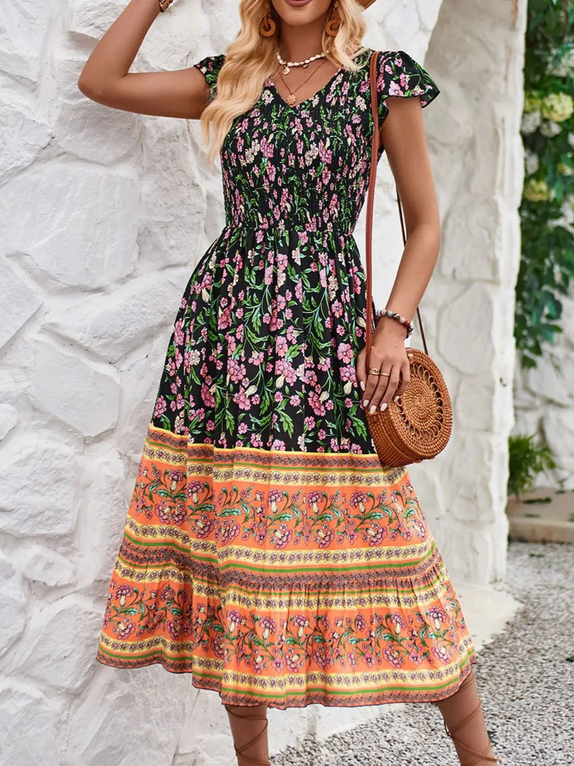 Cassandra - Elegante vestido floral de manga casquillo