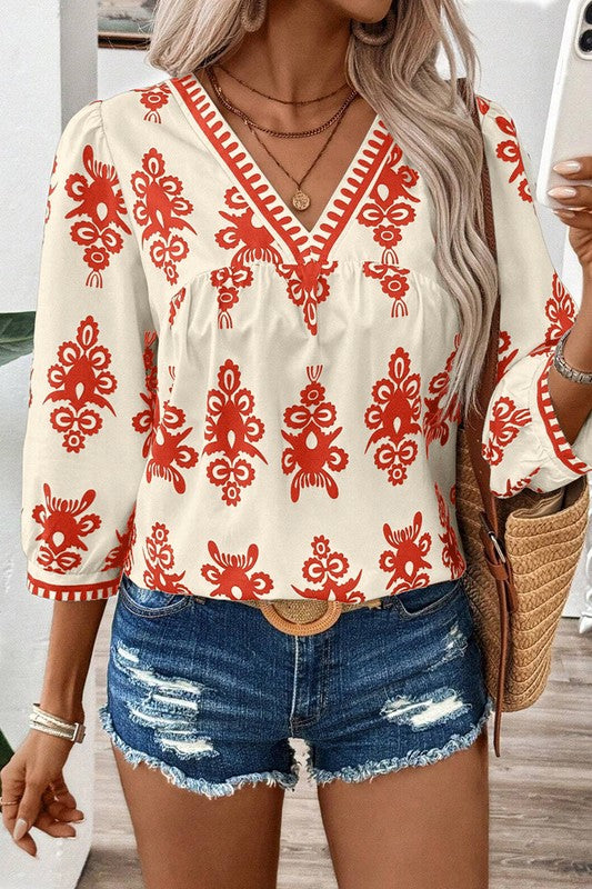 Joy - Elegante blusa con estampado geométrico de media manga y cuello en V