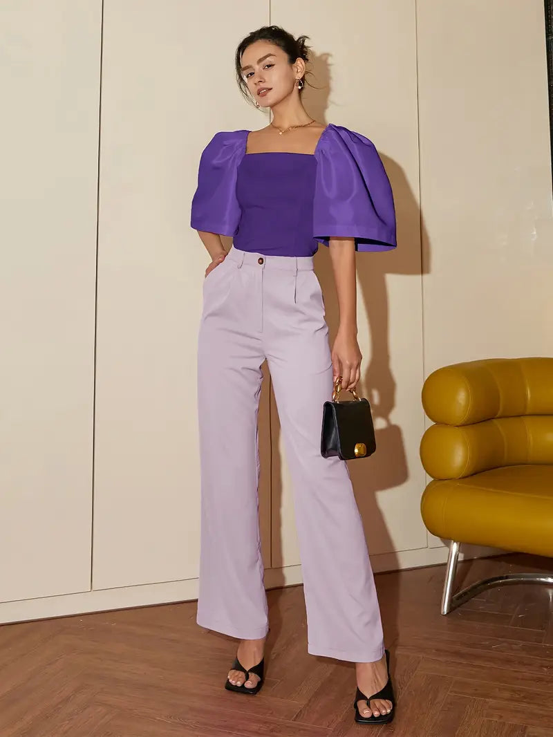 Clara – Elegante blusa de raso con mangas abullonadas