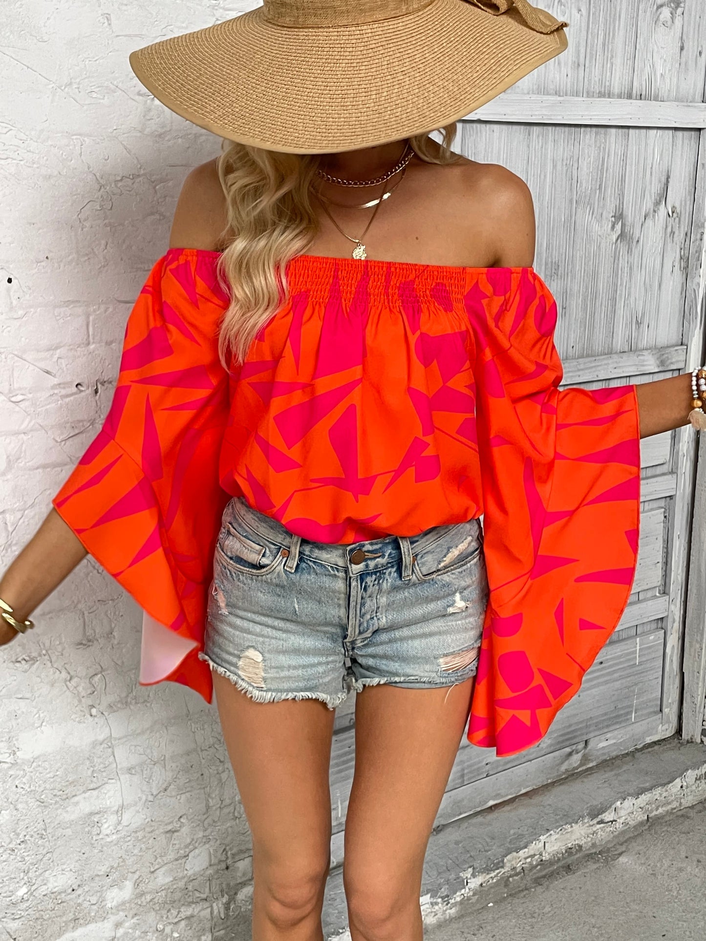 Bianca - Elegante blusa con hombros descubiertos y manga murciélago