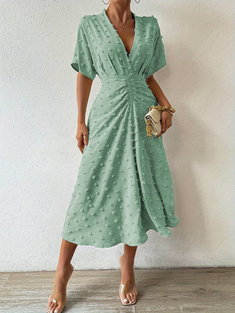 Janelle - Elegante vestido con volante de lunares suizos
