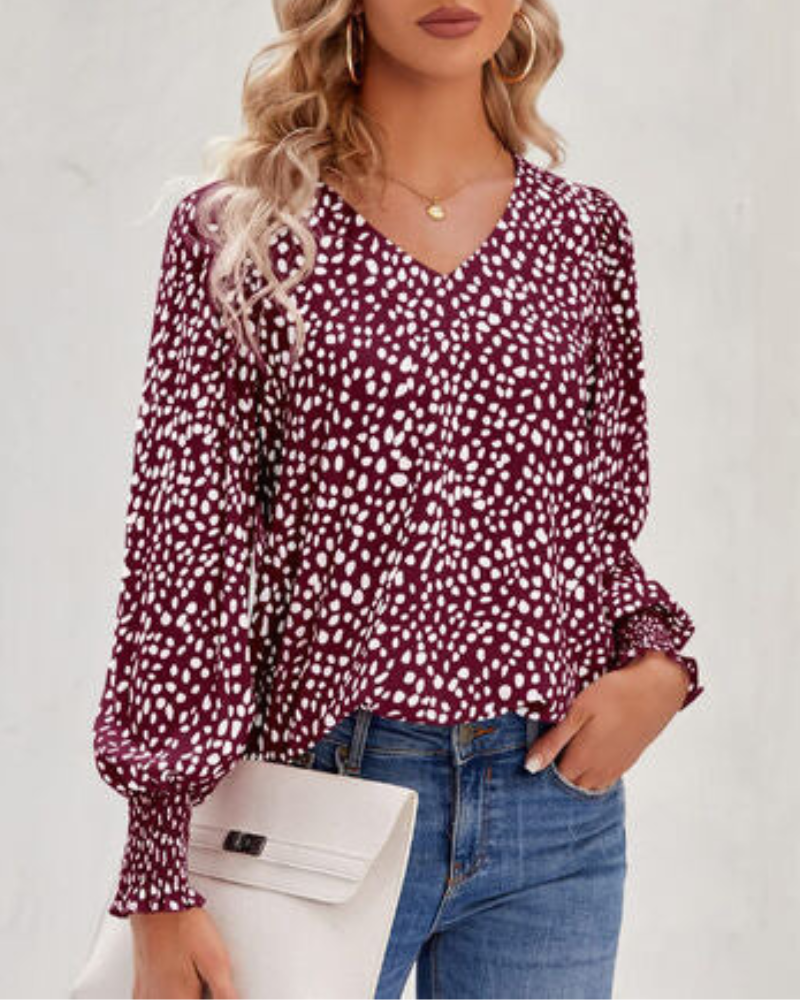 Maureen - Elegante blusa estampada con cuello de pico y manga farol