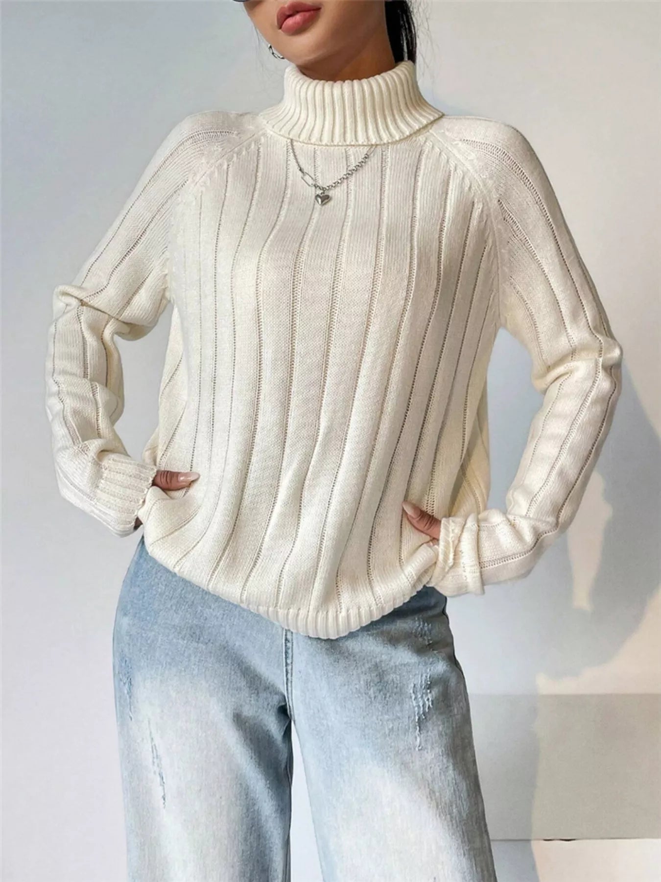 Kaila - Elegante jersey de manga larga con cuello alto y canalé