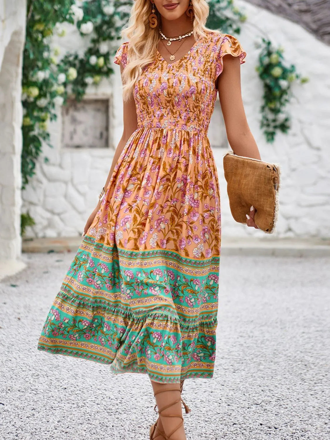 Cassandra - Elegante vestido floral de manga casquillo