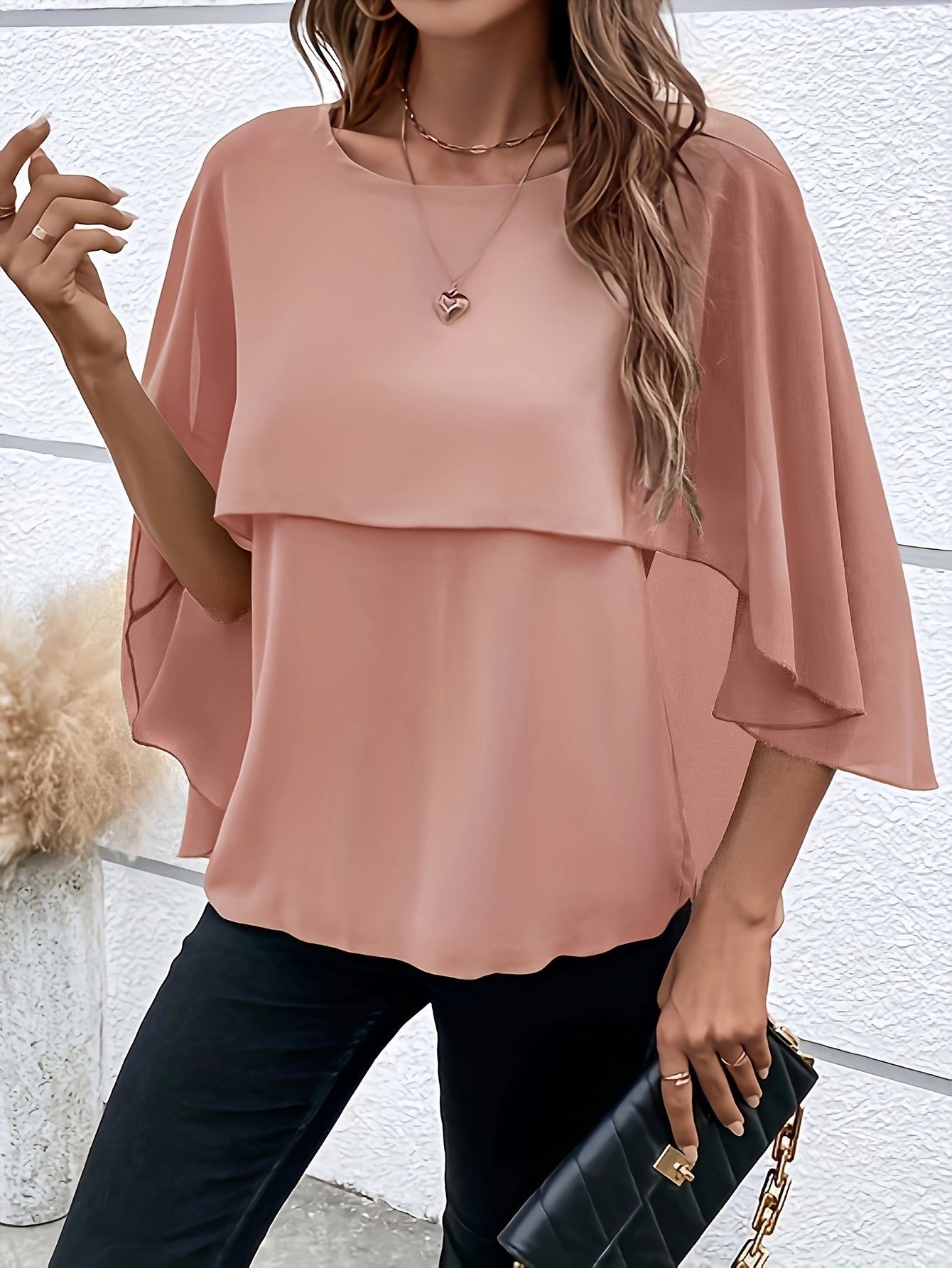 Arah - Elegante blusa a capas con mangas murciélago