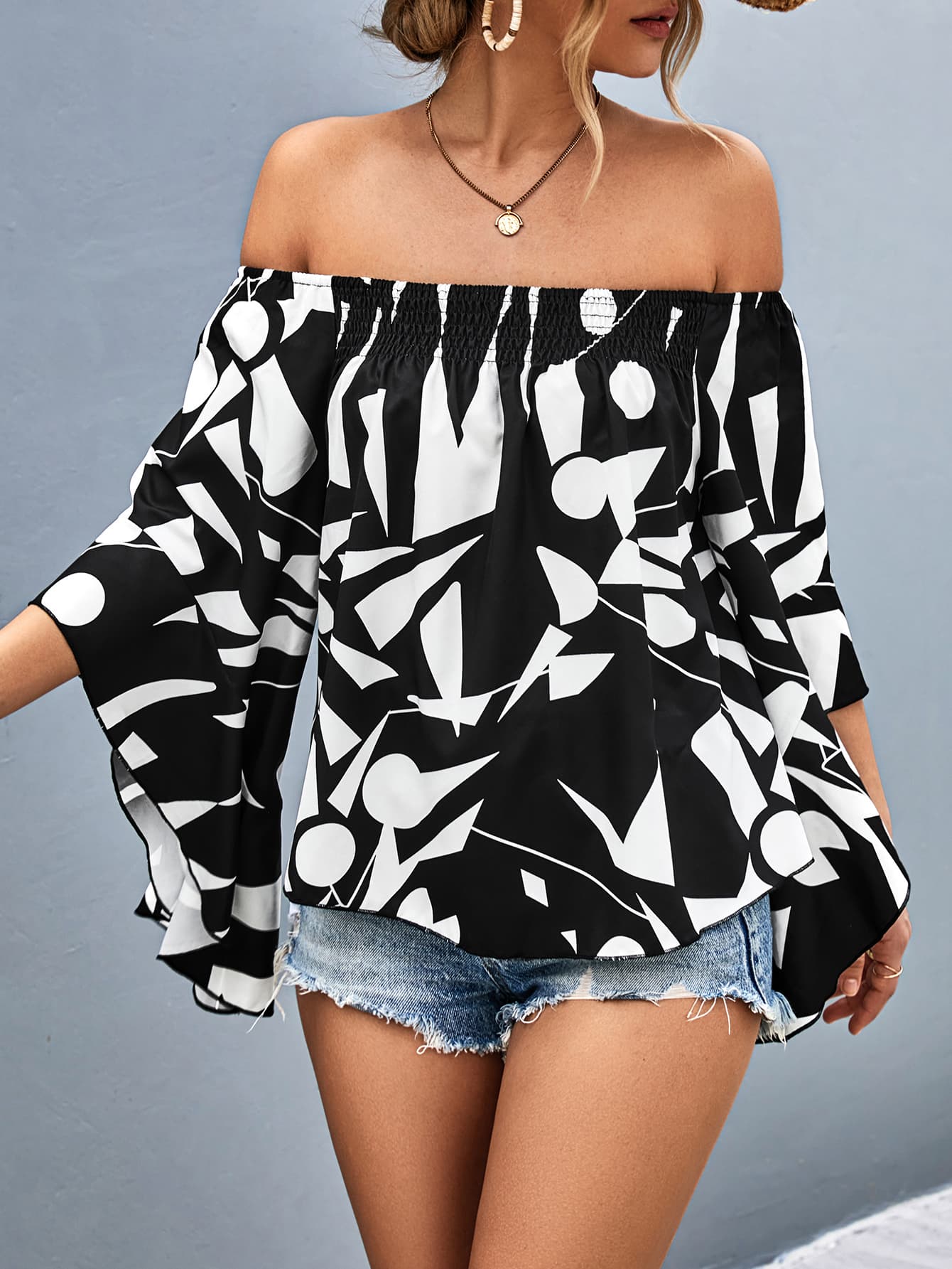 Bianca - Elegante blusa con hombros descubiertos y manga murciélago