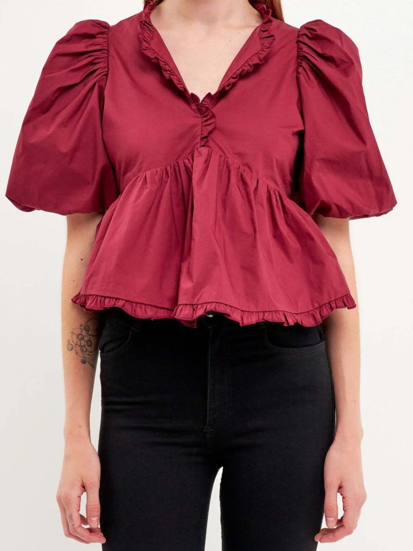 Kath - Elegante blusa peplum con mangas abullonadas