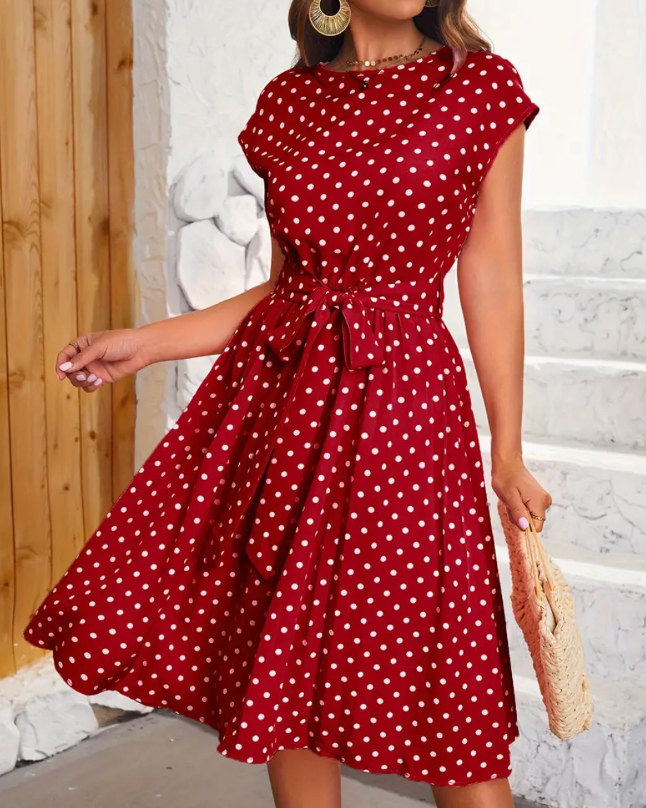 Teresa - Elegante vestido midi de lunares con cinturón de anudar