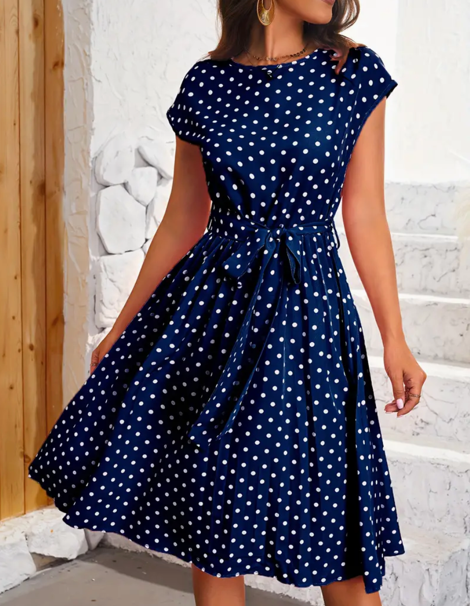Teresa - Elegante vestido midi de lunares con cinturón de anudar