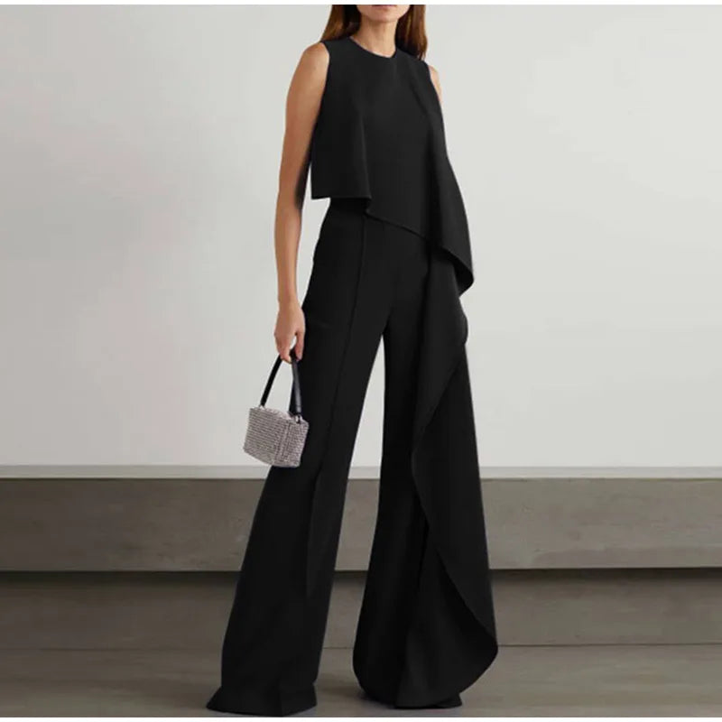 Tressa - Elegante mono de pierna ancha con volante y sin mangas