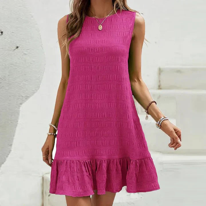 Milena - Elegante minivestido sin mangas con volante en el dobladillo