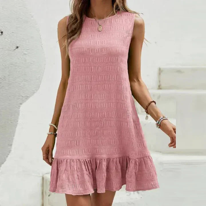 Milena - Elegante minivestido sin mangas con volante en el dobladillo