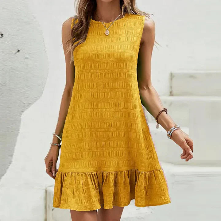 Milena - Elegante minivestido sin mangas con volante en el dobladillo