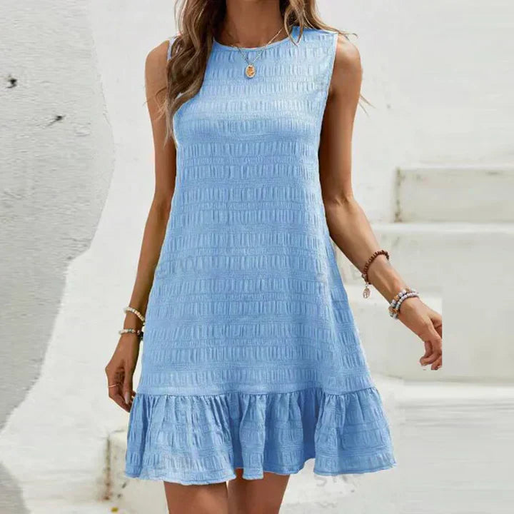 Milena - Elegante minivestido sin mangas con volante en el dobladillo