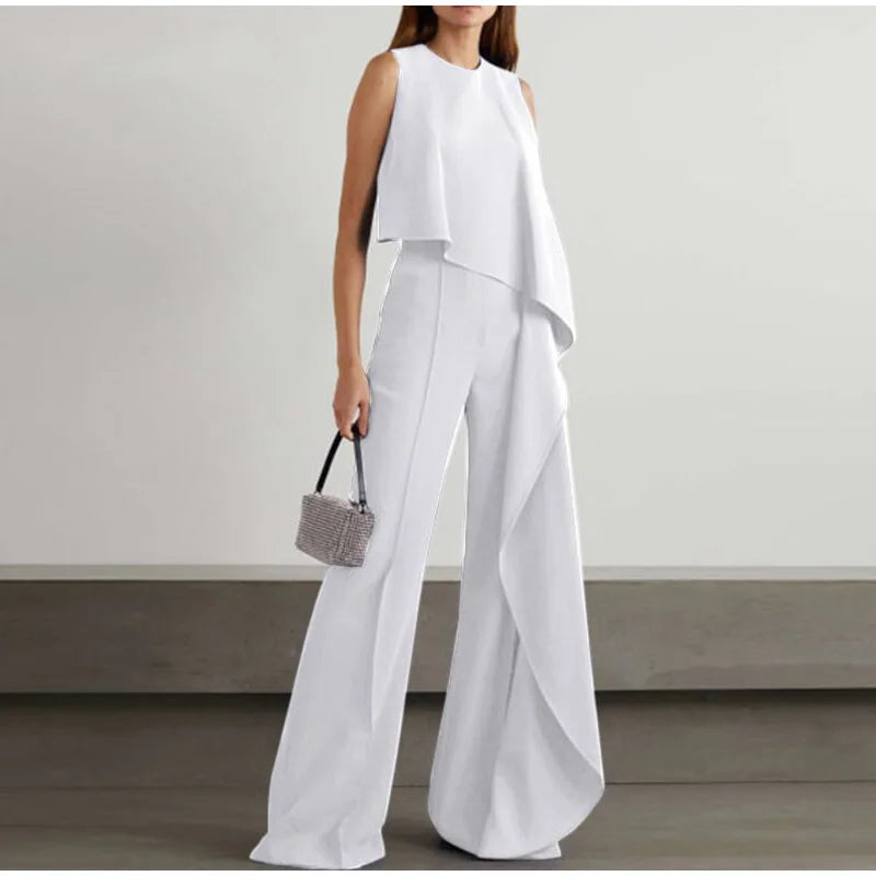Tressa - Elegante mono de pierna ancha con volante y sin mangas