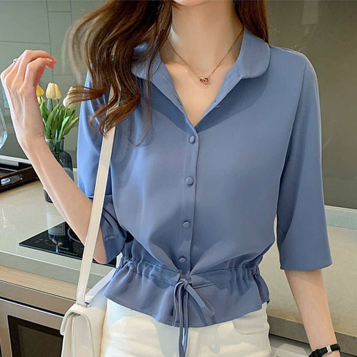 Zyrah - Elegante blusa polo abotonada