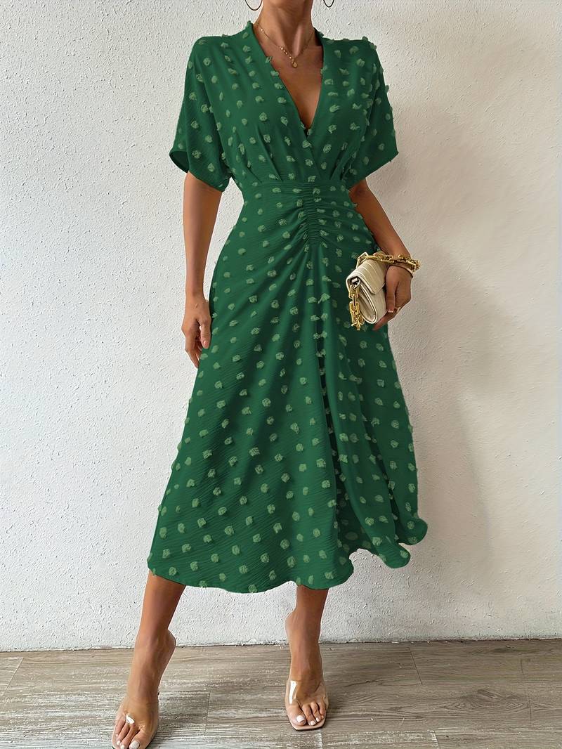 Janelle - Elegante vestido con volante de lunares suizos