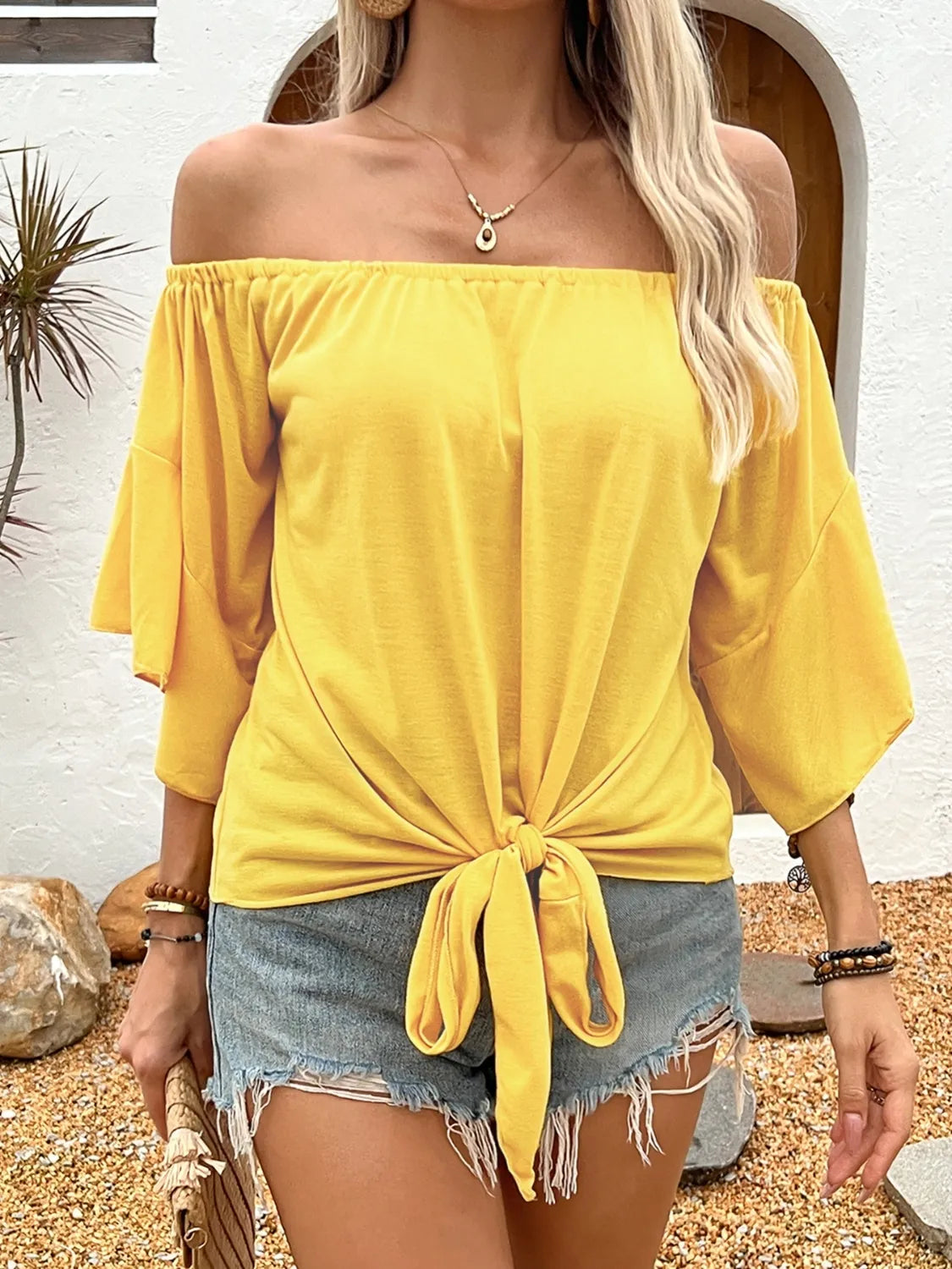 Gwen - Elegante blusa con hombros al descubierto y lazada suelta