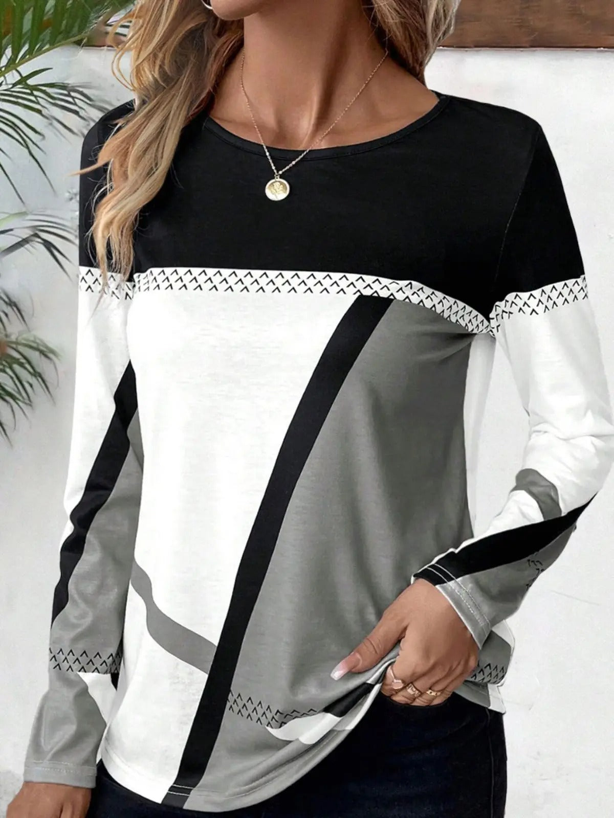 Cathryn - Elegante blusa de manga larga en bloques de color