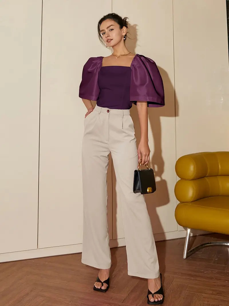 Clara – Elegante blusa de raso con mangas abullonadas