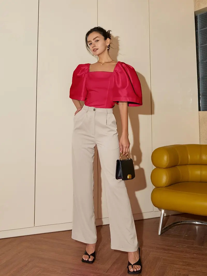 Clara – Elegante blusa de raso con mangas abullonadas