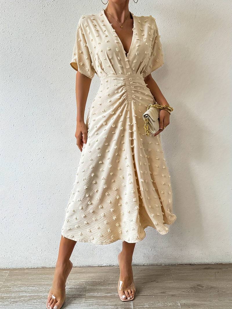 Janelle - Elegante vestido con volante de lunares suizos