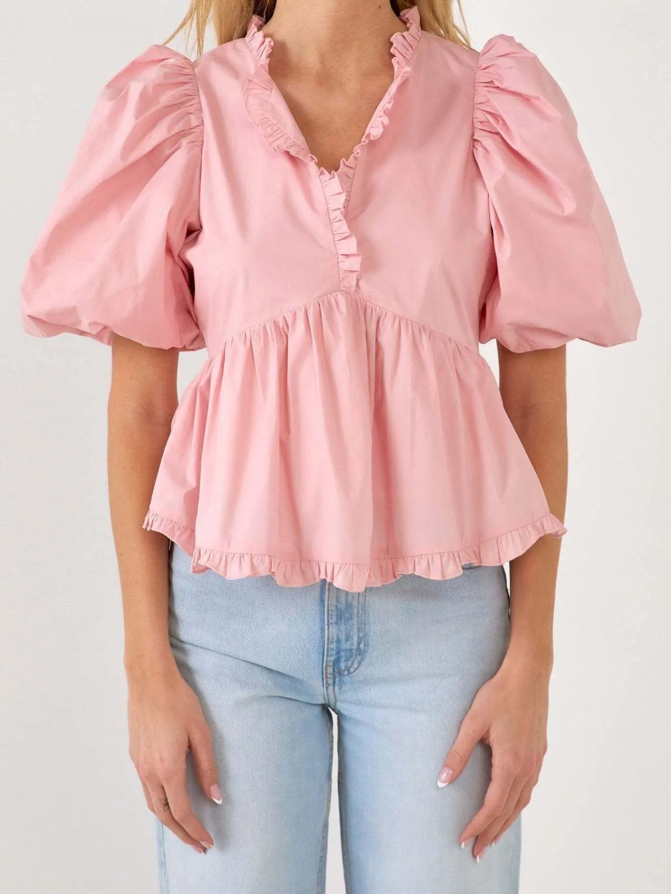 Kath - Elegante blusa peplum con mangas abullonadas