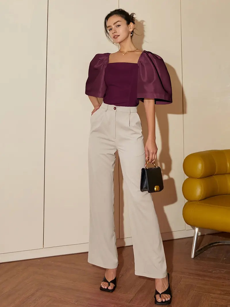 Clara – Elegante blusa de raso con mangas abullonadas