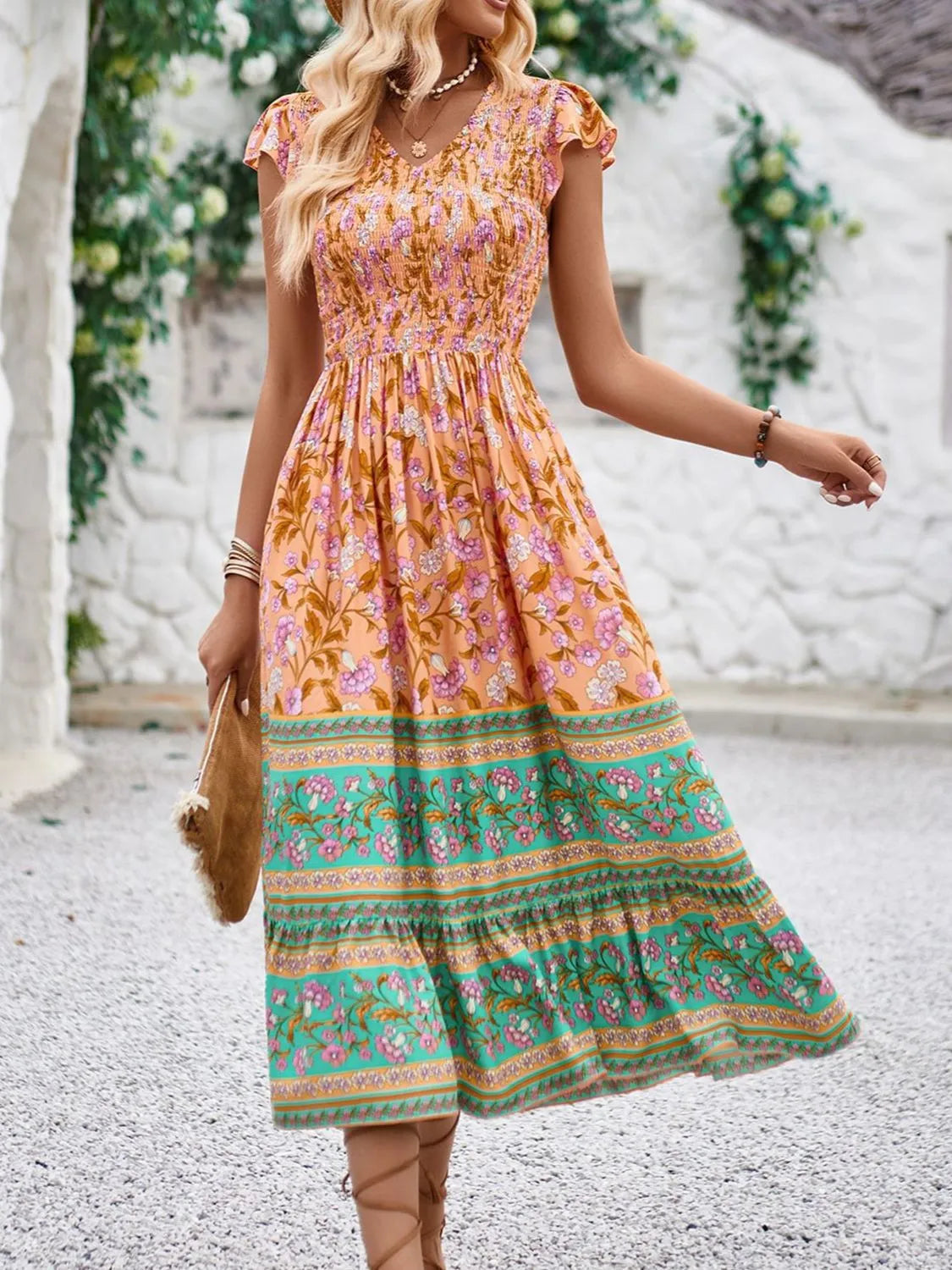 Cassandra - Elegante vestido floral de manga casquillo